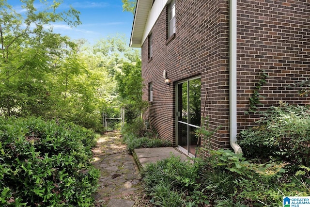 5420 Pine St, Sylvan Springs, AL 35118 - view of property exterior featuring brick siding and a gate