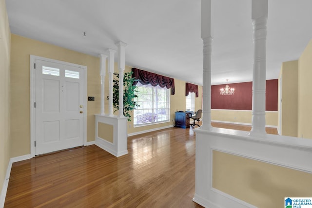 5420 Pine St, Sylvan Springs, AL 35118 - foyer entrance with wood finished floors, a chandelier, and baseboards