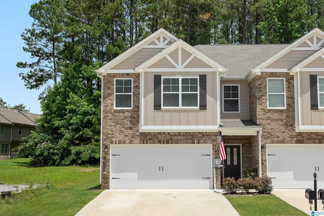119 Polo Downs, Chelsea, AL 35043 - craftsman-style home with a garage, a front yard, driveway, board and batten siding, and a shingled roof