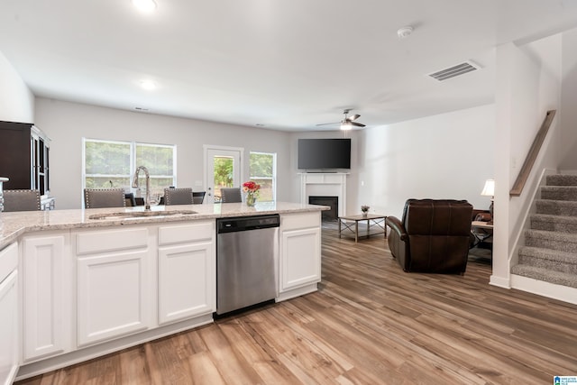 119 Polo Downs, Chelsea, AL 35043 - kitchen with dishwasher, a sink, a ceiling fan, light wood-style flooring, and a fireplace