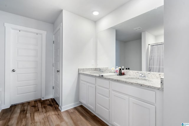 119 Polo Downs, Chelsea, AL 35043 - bathroom featuring double vanity, wood finished floors, and baseboards