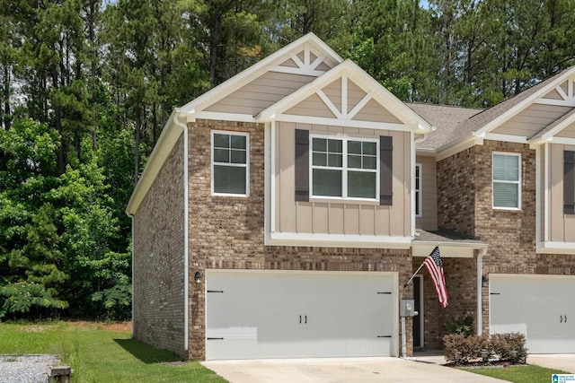 119 Polo Downs, Chelsea, AL 35043 - craftsman house featuring an attached garage, concrete driveway, board and batten siding, and brick siding