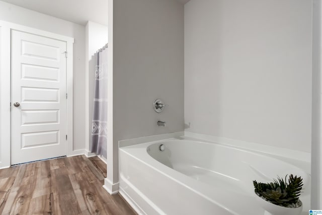 119 Polo Downs, Chelsea, AL 35043 - full bath featuring a garden tub, wood finished floors, baseboards, and a shower with shower curtain