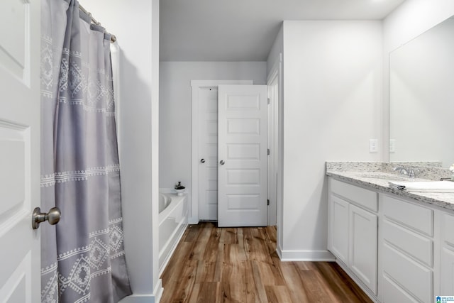 119 Polo Downs, Chelsea, AL 35043 - bathroom featuring wood finished floors, vanity, a bathtub, baseboards, and curtained shower