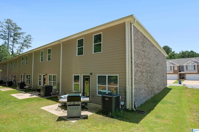 119 Polo Downs, Chelsea, AL 35043 - back of property featuring central air condition unit, a patio, and a yard