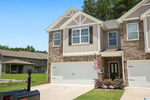 119 Polo Downs, Chelsea, AL 35043 - craftsman-style house featuring board and batten siding, an attached garage, concrete driveway, and a front lawn