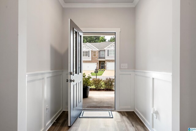 119 Polo Downs, Chelsea, AL 35043 - doorway to outside featuring a decorative wall, wood finished floors, wainscoting, and ornamental molding