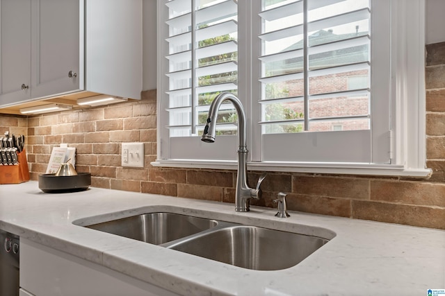 5265 Lake Crest Cir, Hoover, AL 35226 - kitchen featuring a sink, decorative backsplash, light stone countertops, and white cabinets