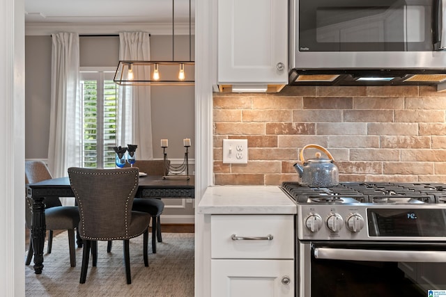 5265 Lake Crest Cir, Hoover, AL 35226 - kitchen with stainless steel appliances, white cabinetry, ornamental molding, light stone counters, and backsplash