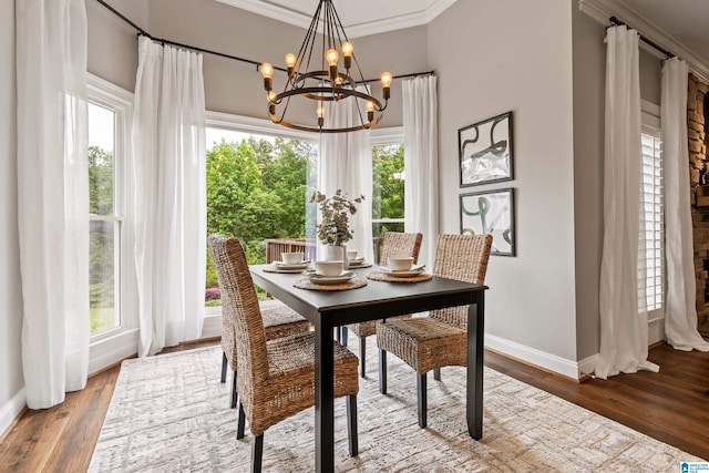 5265 Lake Crest Cir, Hoover, AL 35226 - dining room featuring a chandelier, baseboards, wood finished floors, and crown molding
