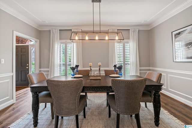 5265 Lake Crest Cir, Hoover, AL 35226 - dining space featuring wood finished floors, crown molding, a decorative wall, and a wainscoted wall