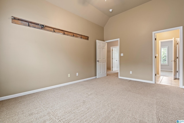 5265 Lake Crest Cir, Hoover, AL 35226 - unfurnished bedroom with light carpet, baseboards, and high vaulted ceiling