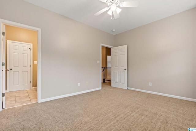 5265 Lake Crest Cir, Hoover, AL 35226 - unfurnished bedroom with light colored carpet, baseboards, and ceiling fan