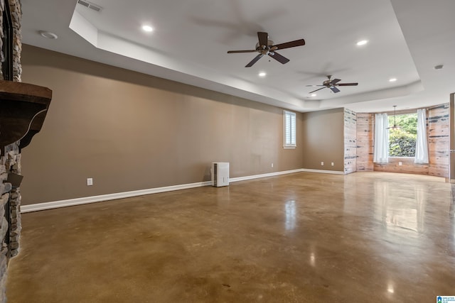 5265 Lake Crest Cir, Hoover, AL 35226 - unfurnished living room featuring a raised ceiling, concrete flooring, a ceiling fan, baseboards, and recessed lighting