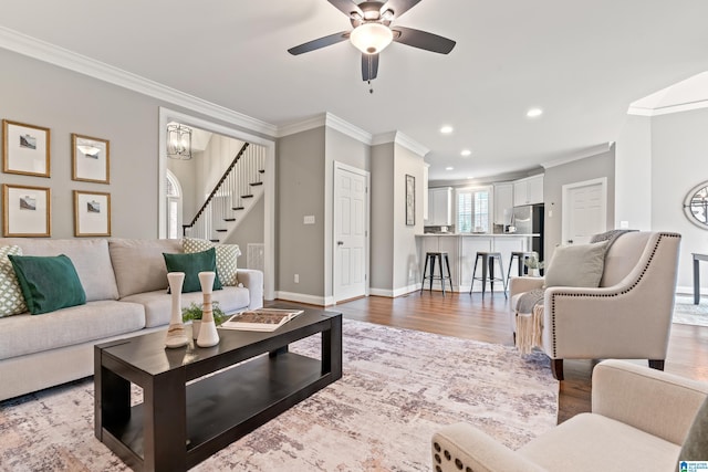 5265 Lake Crest Cir, Hoover, AL 35226 - living room featuring ornamental molding, stairway, wood finished floors, recessed lighting, and a ceiling fan