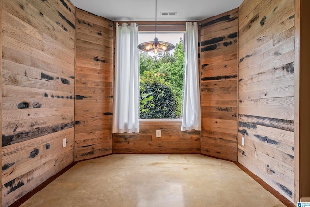5265 Lake Crest Cir, Hoover, AL 35226 - spare room featuring wood walls and unfinished concrete floors