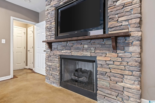 5265 Lake Crest Cir, Hoover, AL 35226 - detailed view of a stone fireplace, baseboards, and concrete floors