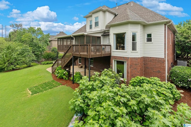 5265 Lake Crest Cir, Hoover, AL 35226 - back of property with a sunroom, brick siding, a patio area, a yard, and stairs