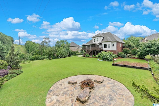 5265 Lake Crest Cir, Hoover, AL 35226 - view of grassy yard featuring stairway, an outdoor fire pit, a patio area, and a wooden deck