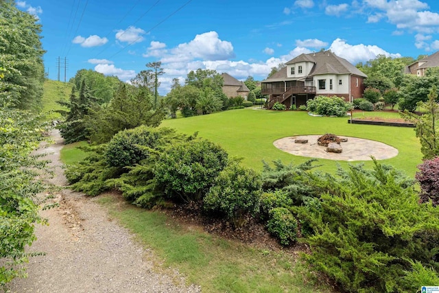 5265 Lake Crest Cir, Hoover, AL 35226 - view of grassy yard with stairs, an outdoor fire pit, and a deck