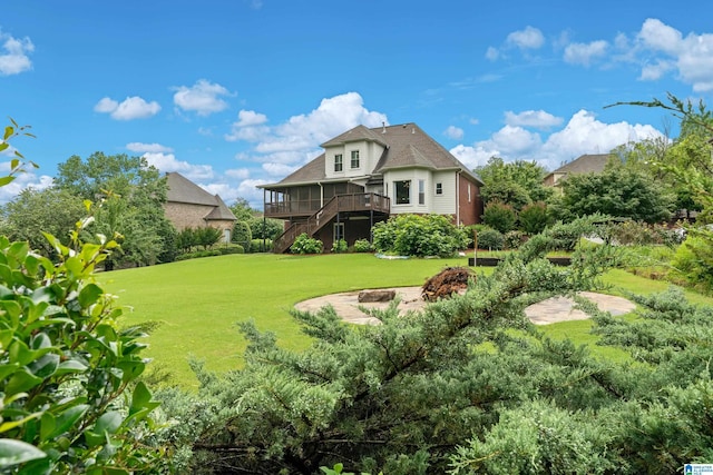 5265 Lake Crest Cir, Hoover, AL 35226 - rear view of house with stairway, a wooden deck, and a lawn