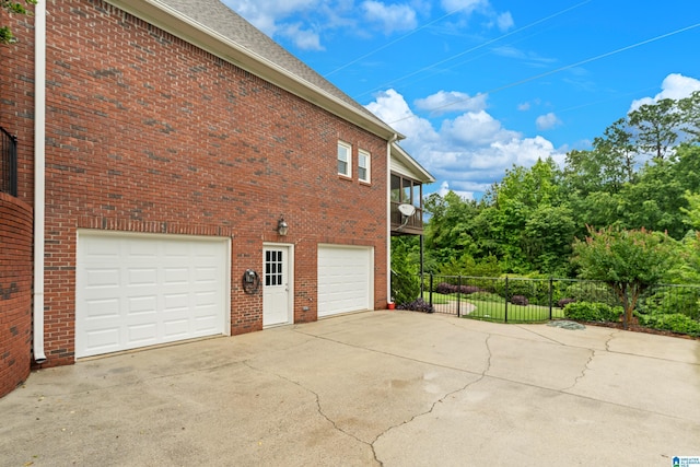 5265 Lake Crest Cir, Hoover, AL 35226 - view of property exterior with concrete driveway, a garage, and brick siding