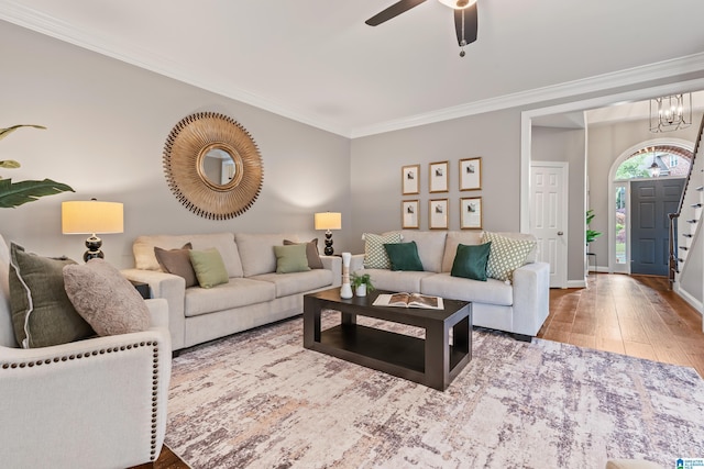 5265 Lake Crest Cir, Hoover, AL 35226 - living room with crown molding, hardwood / wood-style flooring, a ceiling fan, baseboards, and stairs