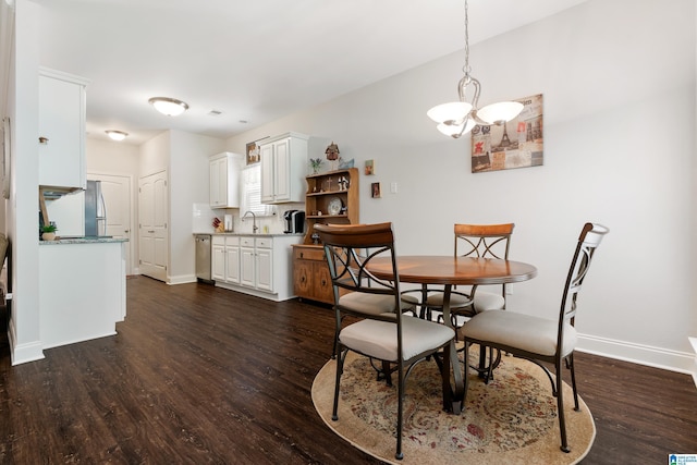 3096 Hidden Forest Cv, Montevallo, AL 35115 - dining space featuring dark wood-style flooring, a chandelier, and baseboards