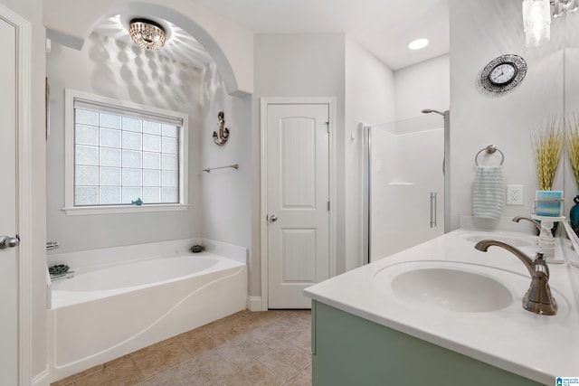 3096 Hidden Forest Cv, Montevallo, AL 35115 - bathroom with a bath, double vanity, a stall shower, and tile patterned floors