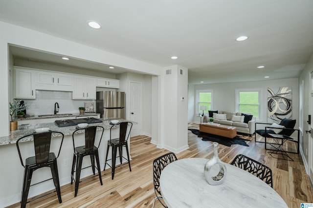 1751 Valley Ave Unit D, Homewood, AL 35209 - dining room featuring light wood-type flooring, recessed lighting, and baseboards