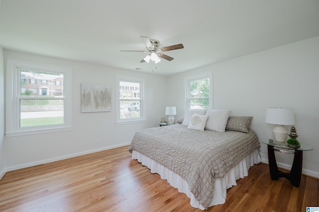 1751 Valley Ave Unit D, Homewood, AL 35209 - bedroom with light wood-style floors, baseboards, and ceiling fan