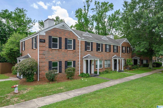 1751 Valley Ave Unit D, Homewood, AL 35209 - townhome / multi-family property with a chimney and brick siding