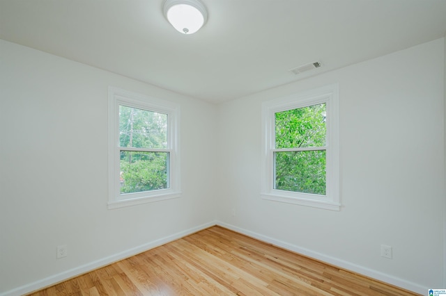 1751 Valley Ave Unit D, Homewood, AL 35209 - unfurnished room with baseboards, plenty of natural light, and wood finished floors