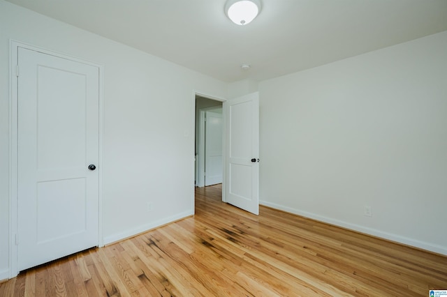 1751 Valley Ave Unit D, Homewood, AL 35209 - unfurnished bedroom featuring wood finished floors and baseboards