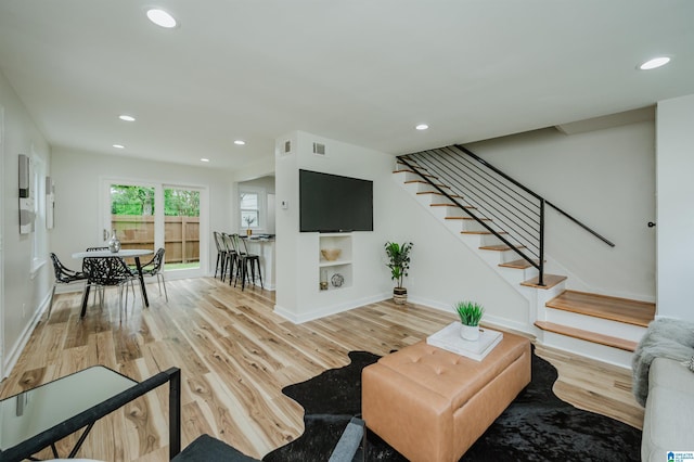 1751 Valley Ave Unit D, Homewood, AL 35209 - living room with stairs, wood finished floors, baseboards, and recessed lighting