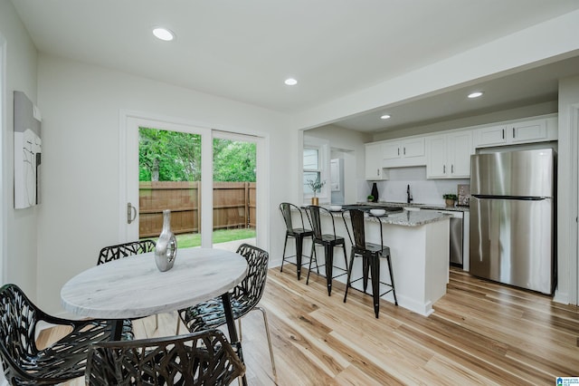 1751 Valley Ave Unit D, Homewood, AL 35209 - dining room featuring light wood-type flooring and recessed lighting