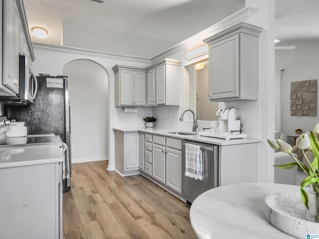 156 Brook Highland Cv, Birmingham, AL 35242 - kitchen with gray cabinets, appliances with stainless steel finishes, a sink, light wood-style floors, and light countertops