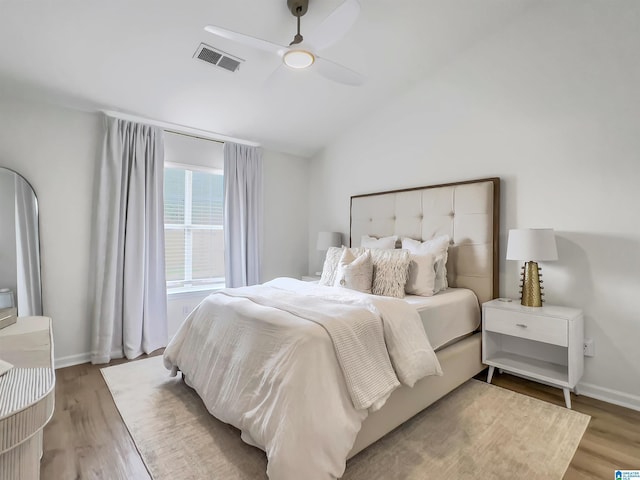 156 Brook Highland Cv, Birmingham, AL 35242 - bedroom with light wood-style floors, lofted ceiling, a ceiling fan, and baseboards