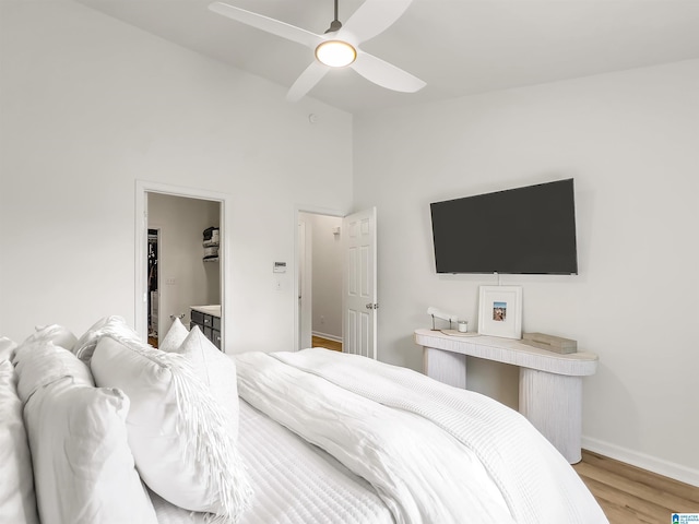 156 Brook Highland Cv, Birmingham, AL 35242 - bedroom with wood finished floors, high vaulted ceiling, baseboards, a spacious closet, and a ceiling fan