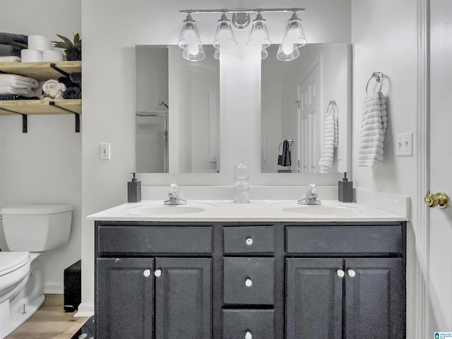 156 Brook Highland Cv, Birmingham, AL 35242 - bathroom with double vanity, toilet, and wood finished floors