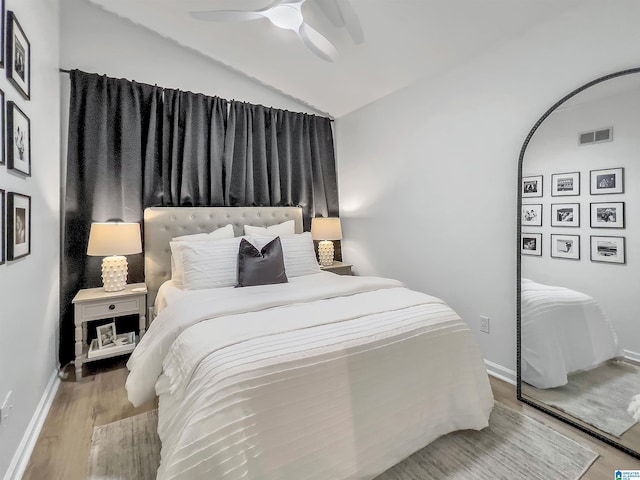 156 Brook Highland Cv, Birmingham, AL 35242 - bedroom with lofted ceiling, wood finished floors, a ceiling fan, and baseboards
