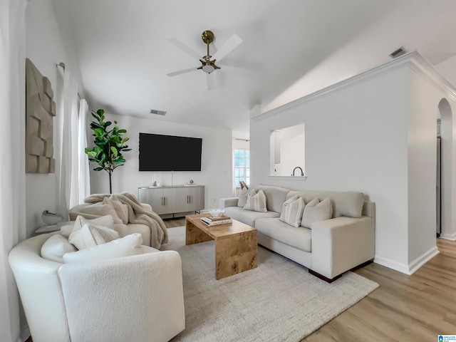 156 Brook Highland Cv, Birmingham, AL 35242 - living area featuring light wood-style flooring, vaulted ceiling, ceiling fan, baseboards, and arched walkways