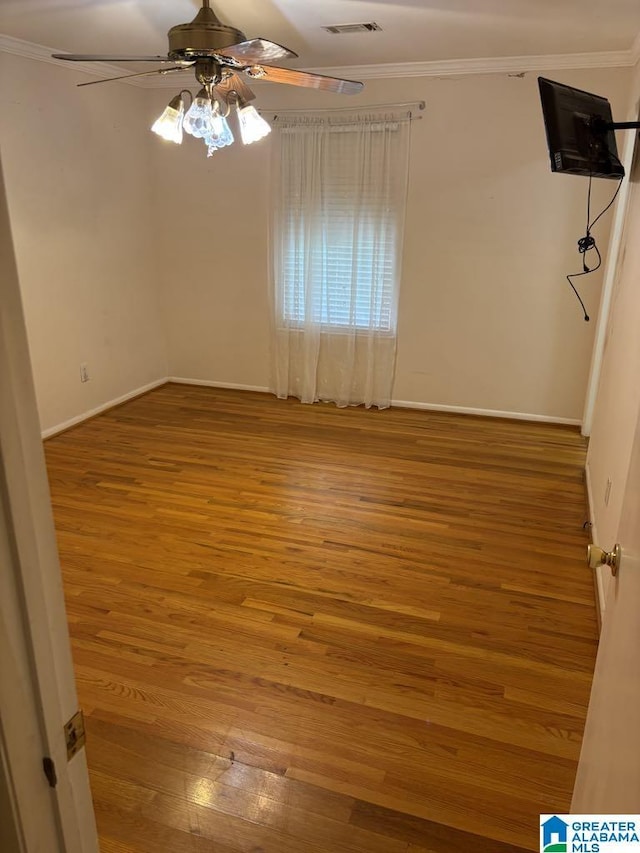 261 Ebenezer Rd, Odenville, AL 35120 - unfurnished room featuring ceiling fan, ornamental molding, wood finished floors, and baseboards
