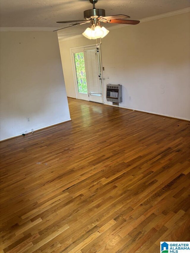 261 Ebenezer Rd, Odenville, AL 35120 - unfurnished living room featuring ceiling fan, hardwood / wood-style floors, crown molding, and heating unit