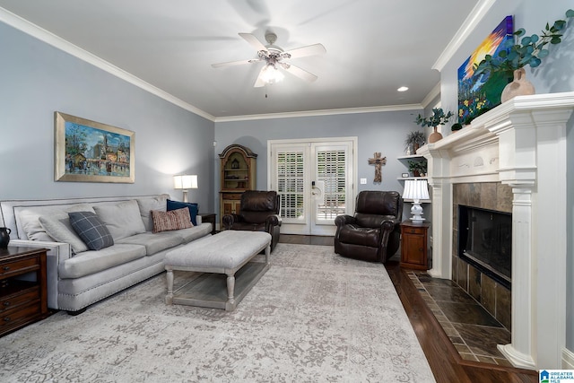 2300 Ridge Trl, Birmingham, AL 35242 - living area featuring crown molding, dark wood-style flooring, ceiling fan, french doors, and a high end fireplace
