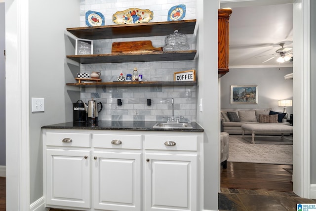 2300 Ridge Trl, Birmingham, AL 35242 - indoor wet bar with backsplash, a ceiling fan, ornamental molding, and dark wood finished floors