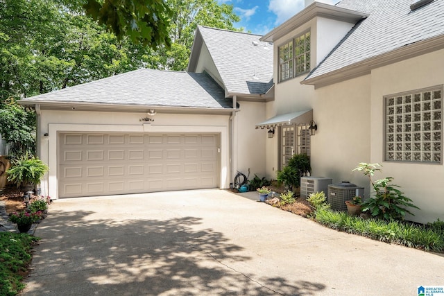 2300 Ridge Trl, Birmingham, AL 35242 - view of front facade featuring stucco siding, concrete driveway, and an attached garage