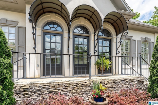 2300 Ridge Trl, Birmingham, AL 35242 - view of exterior entry featuring stucco siding and french doors