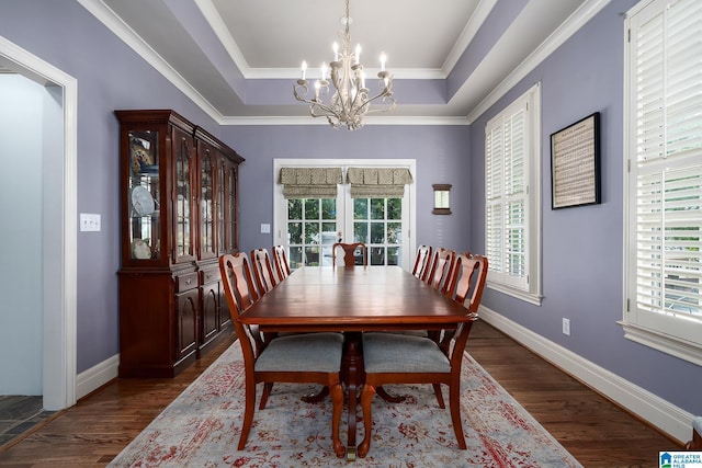 2300 Ridge Trl, Birmingham, AL 35242 - dining space featuring a chandelier, a tray ceiling, dark wood-type flooring, crown molding, and baseboards