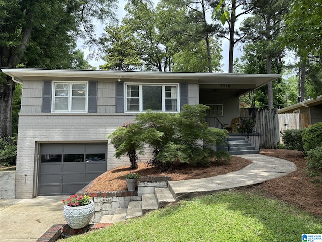 1718 Windsor Blvd, Homewood, AL 35209 - view of front of property featuring brick siding, concrete driveway, and a garage